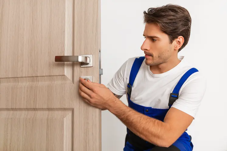 Local locksmith installing a lock in Blackburn