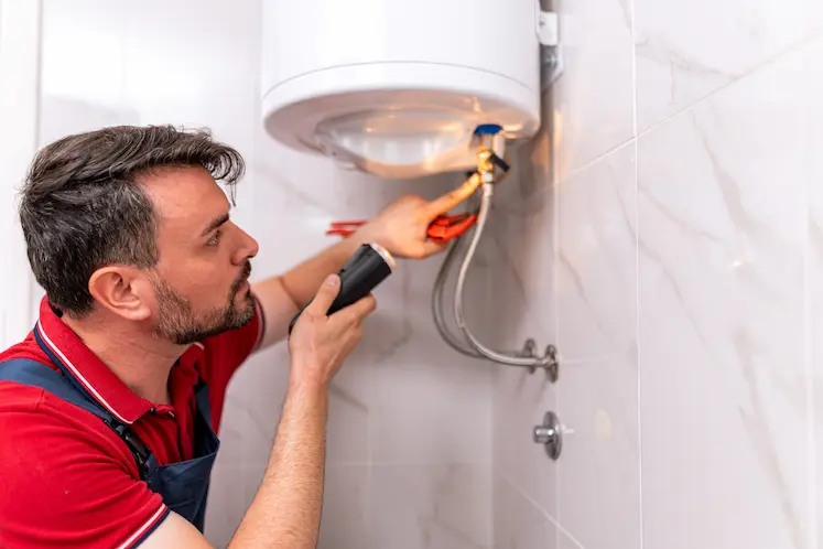 Local plumber carrying out repair work in a Gloucester property